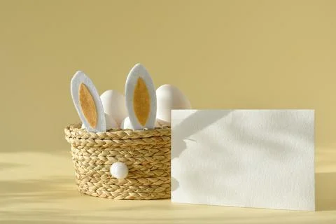 A mock - up of a letter with an Easter basket and eggs on yellow . Easter. .. Stock Photos