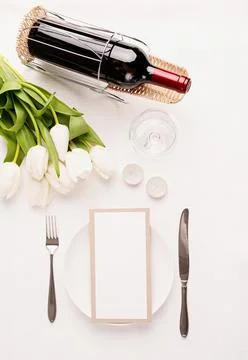 Mock up menu frame in restaurant or cafe. Top view of table setting with menu Stock Photos