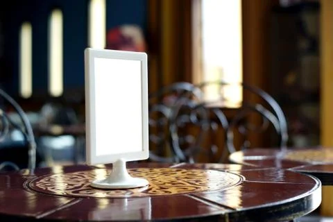 Mock up menu frame stand on table Stock Photos