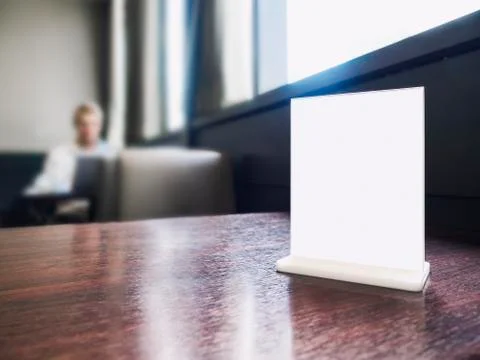 Mock up Menu frame on Table Cafe restaurant Background with blur People Stock Photos