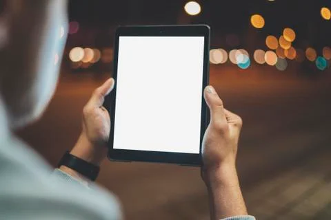 Mock-up of modern digital tablet, night lights and bokeh Stock Photos