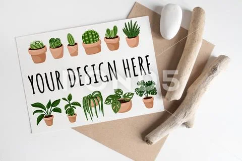 Mock up of postcard among rustic sticks and brown craft envelope on white table PSD Template