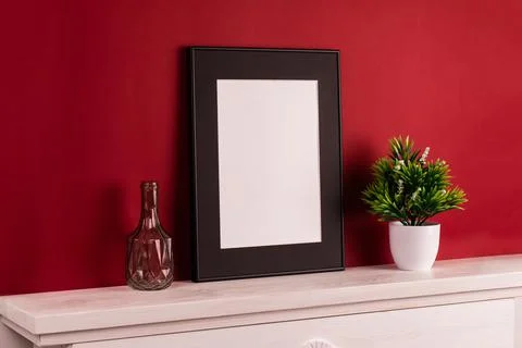Mock up poster. Minimal template with empty picture frame mock up. Red backgr Stock Photos