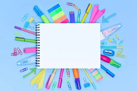 Mock-up school notebook on multicolored various stationery. Stock Photos