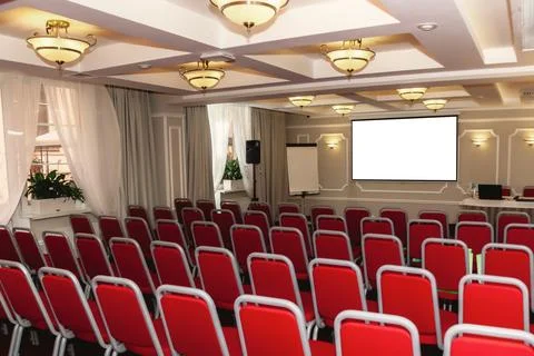 Mock up screen display on wall for creative design in conference hall with re Stock Photos