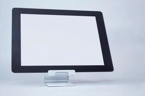 Mock up tablet with white display on a light background. Stock Photos