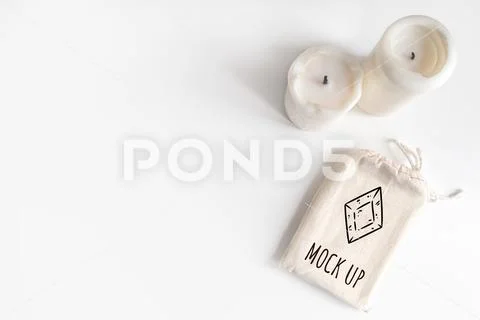 Mock up of tarot deck cotton bag and candles on white background PSD Template