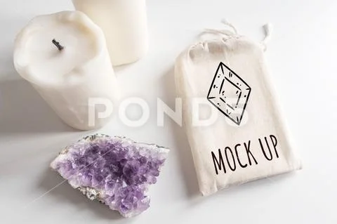 Mock up of tarot deck cotton bag, amethyst and candles on white background PSD Template