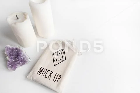 Mock up of tarot deck cotton bag, amethyst and candles on white background PSD Template
