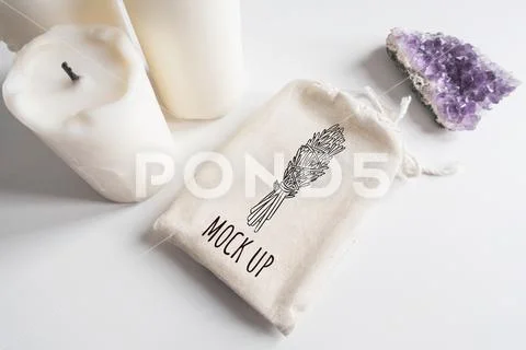 Mock up of tarot deck cotton bag, amethyst and candles on white background PSD Template