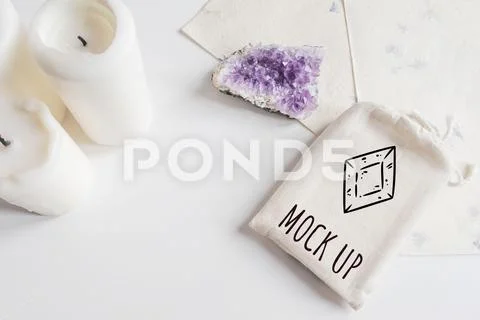 Mock up of tarot deck cotton bag, amethyst and candles on white background PSD Template
