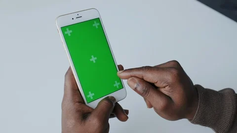 Mock-up Tracking or Green screen in African American Male Hands. Using Handheld Stock Footage 120681433