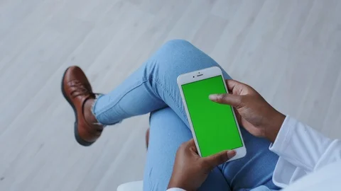 Mock-up Tracking or Green screen in African American Girl Hands. Using Handheld Stock Footage 121090260