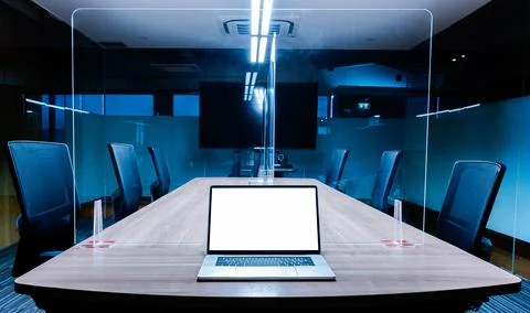 Mock up white screen display laptop on table in meeting room Stock Photos