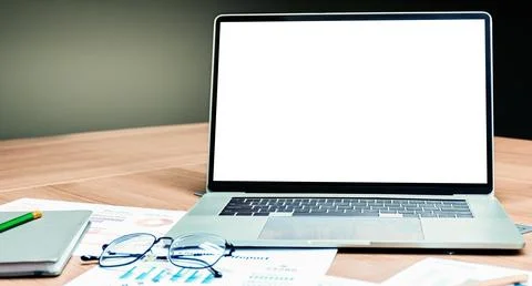 Mock up white screen on display laptop with glasses and notebook on table i.. Stock Photos