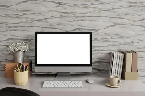 Mock up workspace with Desk top computer white screen and marble wall. Stock Photos