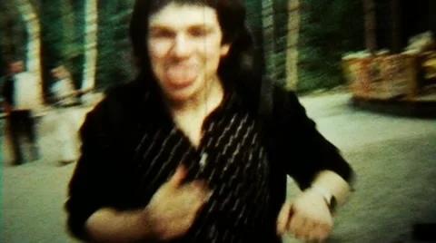 Mocking Dude Grimace Fast Repeated Loop - Vintage Super8 Film Stock Footage 8996924