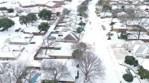 Mockingbird Elementary School campus shows snow-covered rooftops, playground Stock Footage 327614348