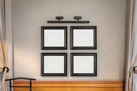 Mockup with 4 frames for a painting or photograph in the wall between the Stock Photos