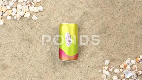 Mockup of aluminum soda can on the sand at the beach PSD Template