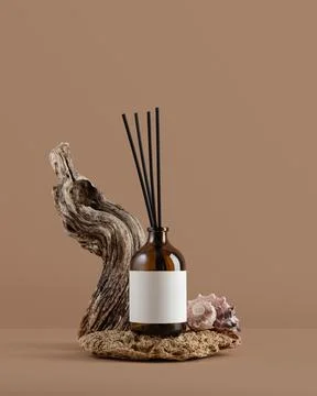 Mockup of amber glass diffuser bottle with blank label, driftwood and seashel Stock Photos