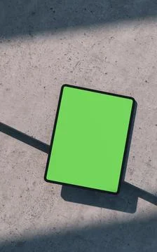Mockup of black tablet device, lay on a concrete surface Stock Illustration