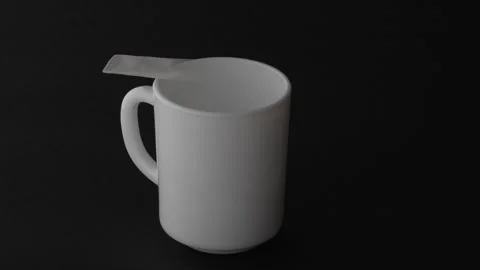 Mockup blank coffee stick appearing on white mug Black Background 4K S-Cineto Видео 332055199