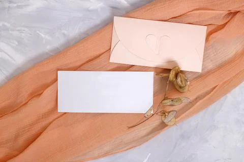 Mockup with blank rectangular sheet of paper and envelope. Stock Photos