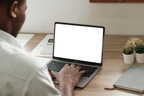 Mockup, blank screen laptop computer. Business man working on laptop computer on Stock Photos