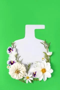 Mockup bottle cosmetics with frame of flowers Stock Photos