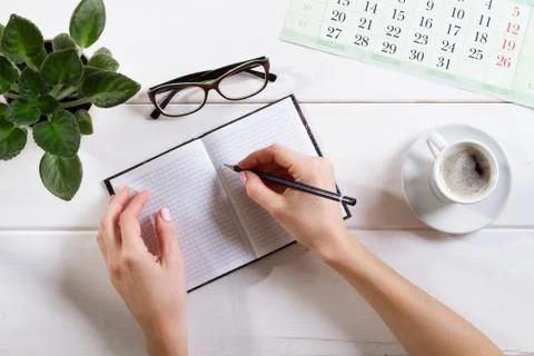 Mockup for check list, empty note paper with pen and coffee cup on light 库存照片