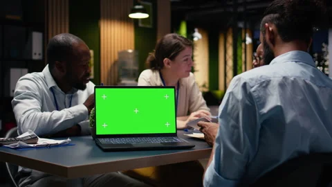 Mockup chroma key laptop used by office employees doing business meeting Stock Footage 334044201