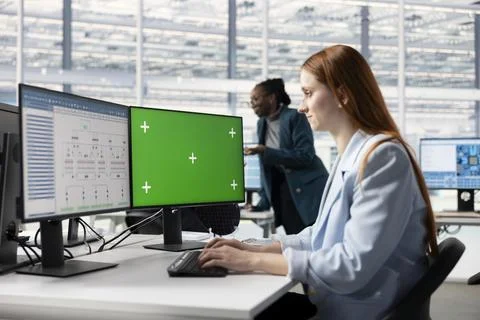 Mockup computer used by researcher evaluating microchip system architecture Stock Photos