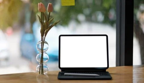 Mockup copy space blank screen laptop and office supplies on white desk. Stock Photos