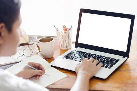 Mockup Copy Space Computer Notebook Laptop Concept, a man's hand using a lapt Stock Photos