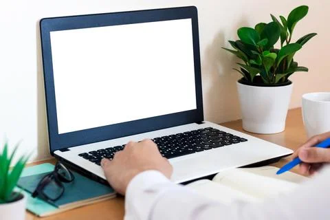 Mockup Copy Space Computer Notebook Laptop Concept , a man's hand using a lap Stock Photos