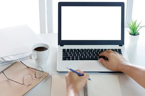 Mockup Copy Space Computer Notebook Laptop Concept , a man's hand using a lap Stock Photos