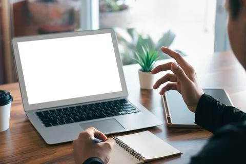 Mockup Copy Space Computer Notebook Laptop Concept , a man's hand using a lap Stock Photos