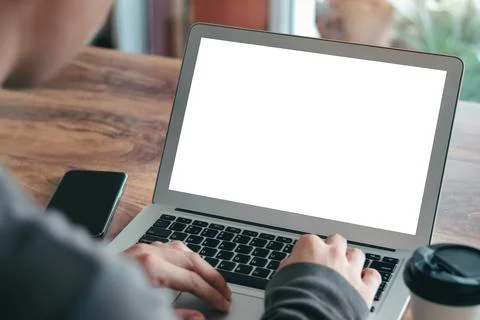 Mockup Copy Space Computer Notebook Laptop Concept , a man's hand using a lap Stock Photos