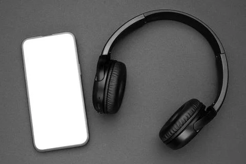 Mockup display. Mobile cell phone blank screen. Black headphones Stock Photos
