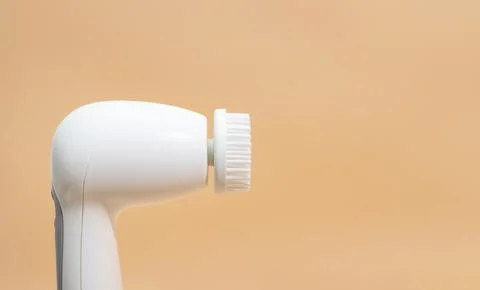 Mockup Electrical Deep Cleansing Face Brush On Peach Orange Background. Copy Stock Photos