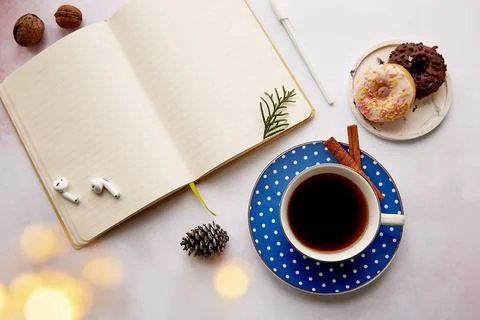 Mockup empty notepad with coffee cup, doughnuts, earphones, Christmas Stock Photos