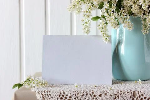 Mockup with an empty sheet of paper and flowering cherry Stock Photos