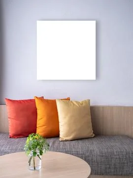 Mockup empty space on blank square frame hanging on white wall background o.. Stock Photos