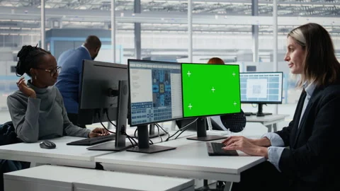 Mockup green screen PC used by woman in microchip factory office Stock Footage 335880354