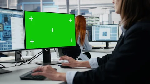 Mockup green screen PC used by woman in microchip factory office Stock Footage 335882170