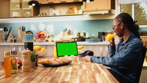 Mockup green screen on tablet in the kitchen with natural light Stock Footage 344245390