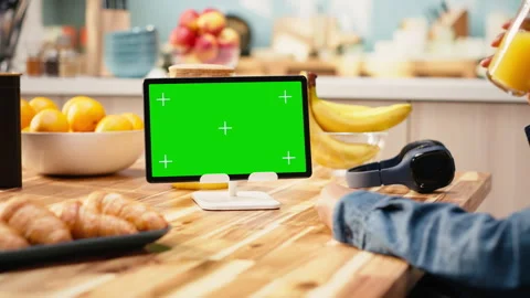 Mockup green screen on tablet in the kitchen with natural light Stock Footage 344248137