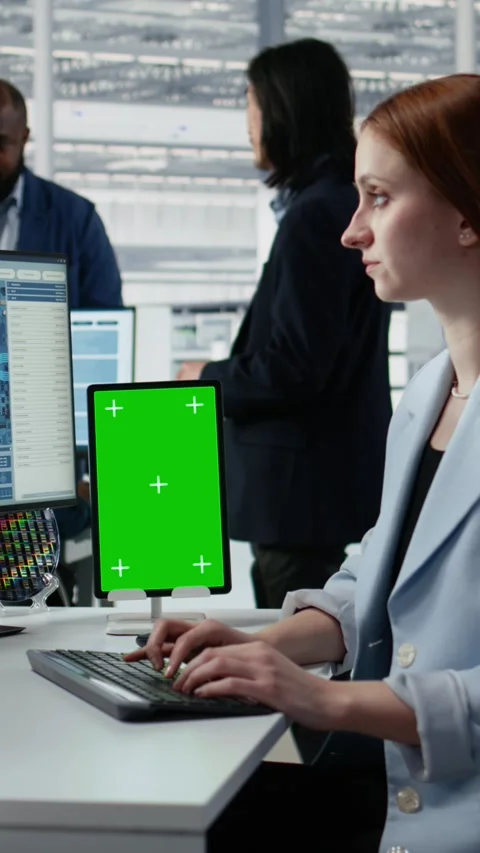 Mockup green screen tablet use by female technician examining microchip circuits Stock Footage 335883259