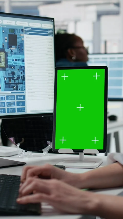 Mockup green screen tablet use by female technician examining microchip circuits Stock Footage 335883665
